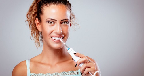 Can you water floss sensitive teeth?
