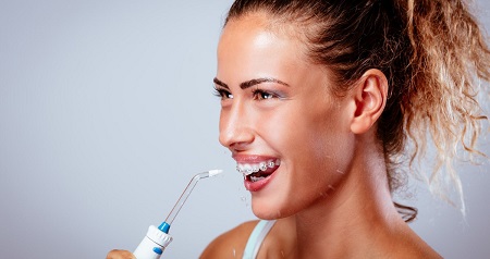 Can you use a water flosser to remove tonsil stones?